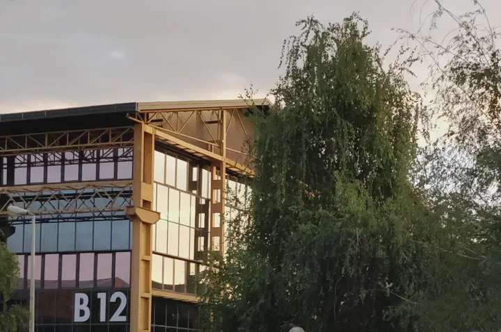 The B12 building at PoliMi Bovisa La Masa campus, headquarter of DAER, in a late Summer evening.